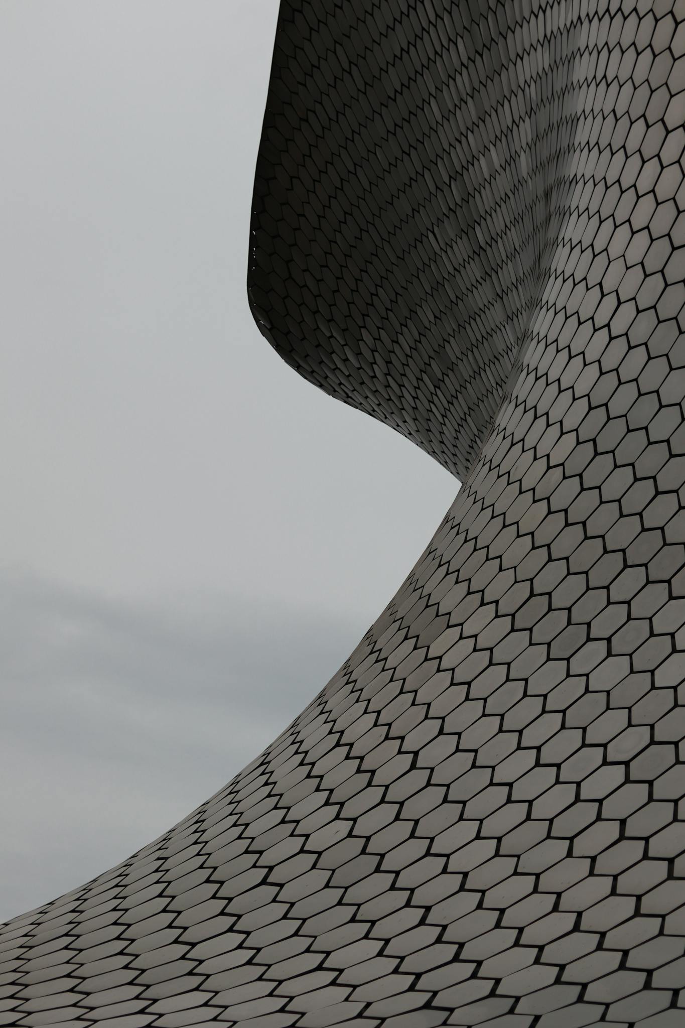 Close-up view of Museo Soumaya's futuristic hexagonal facade design.